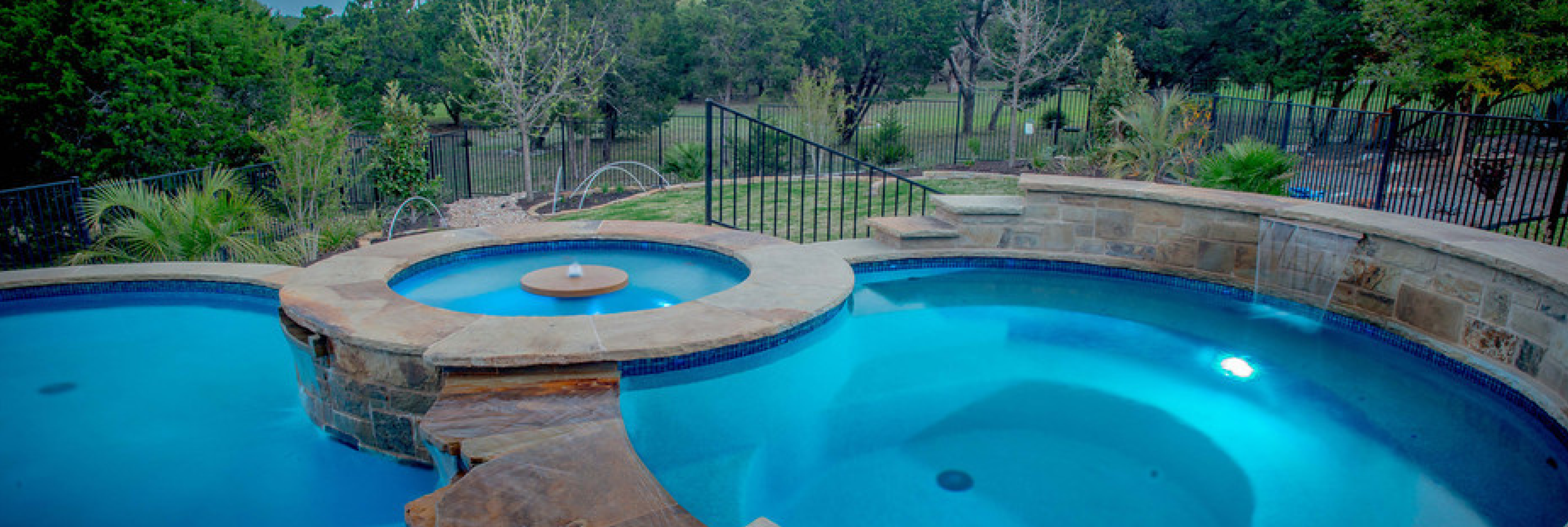 Pristine backyard pool after expert maintenance by Pegasus Pools of Austin