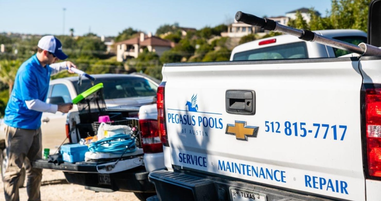 Technician performing detailed pool equipment repairs