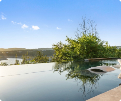 Custom Pool Designs in Austin Luxury custom-designed pool with elegant water features in Austin